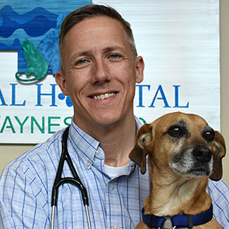 Gregory Lorenz DVM holding a dog